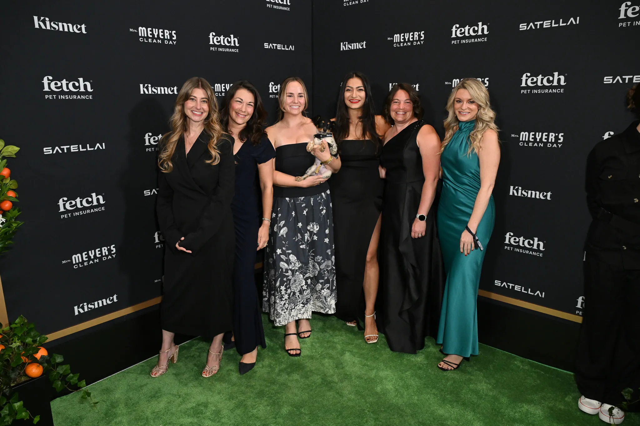 Guests poses with rescue pup from North Shore Animal League America at the 2025 Fetch Pet Gala.