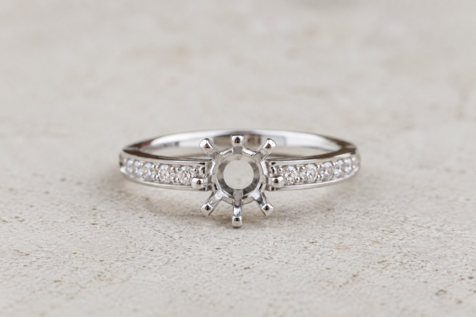 Engagement ring with missing centre stone prior to diamond replacement and setting inspection.