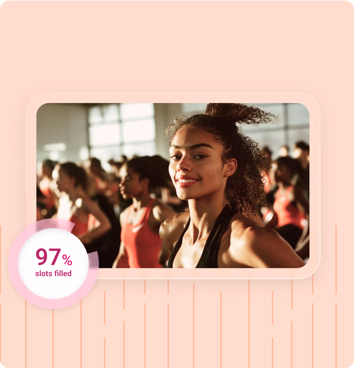 Smiling woman with curly hair in a gym class with other participants in the background and a graphic showing 97% slots filled.