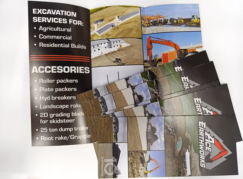 Photo of Ace Earthworks tri-fold brochures - one unfolded and a stack of folded brochures