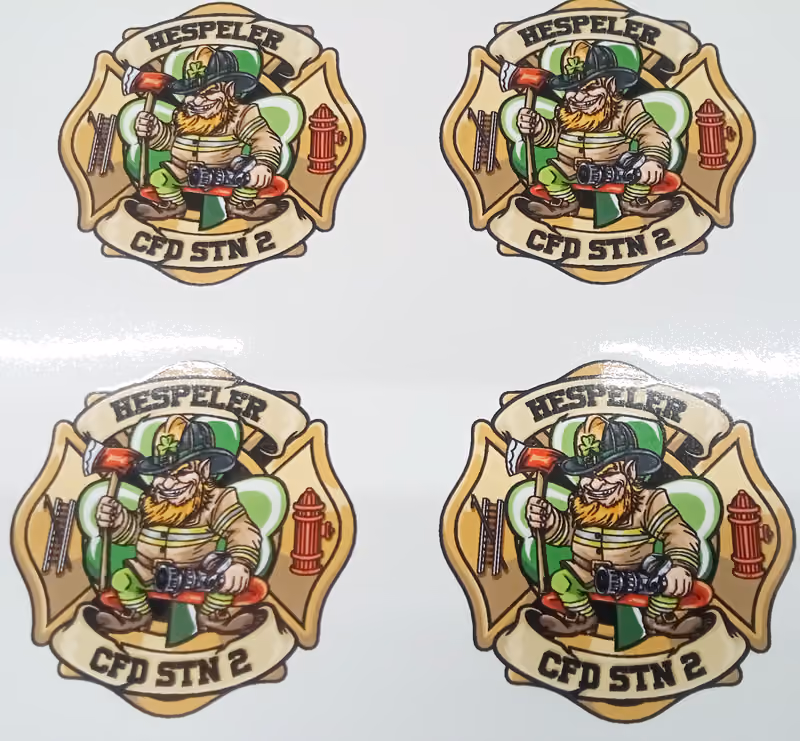 Photo of custom shaped stickers with 'Hespeler CFD STN 2' branding