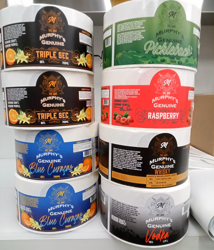 Photo of a variety of labels on rolls with products' descriptions and Murphy's branding
