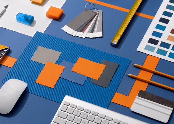 Image of colour samples, keyboard, mouse, pencils and measuring tape