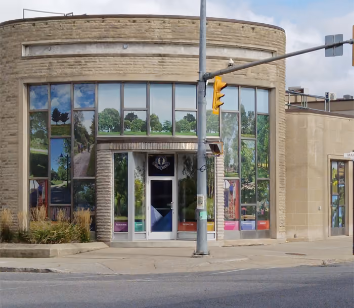 Photo of the building with window graphics