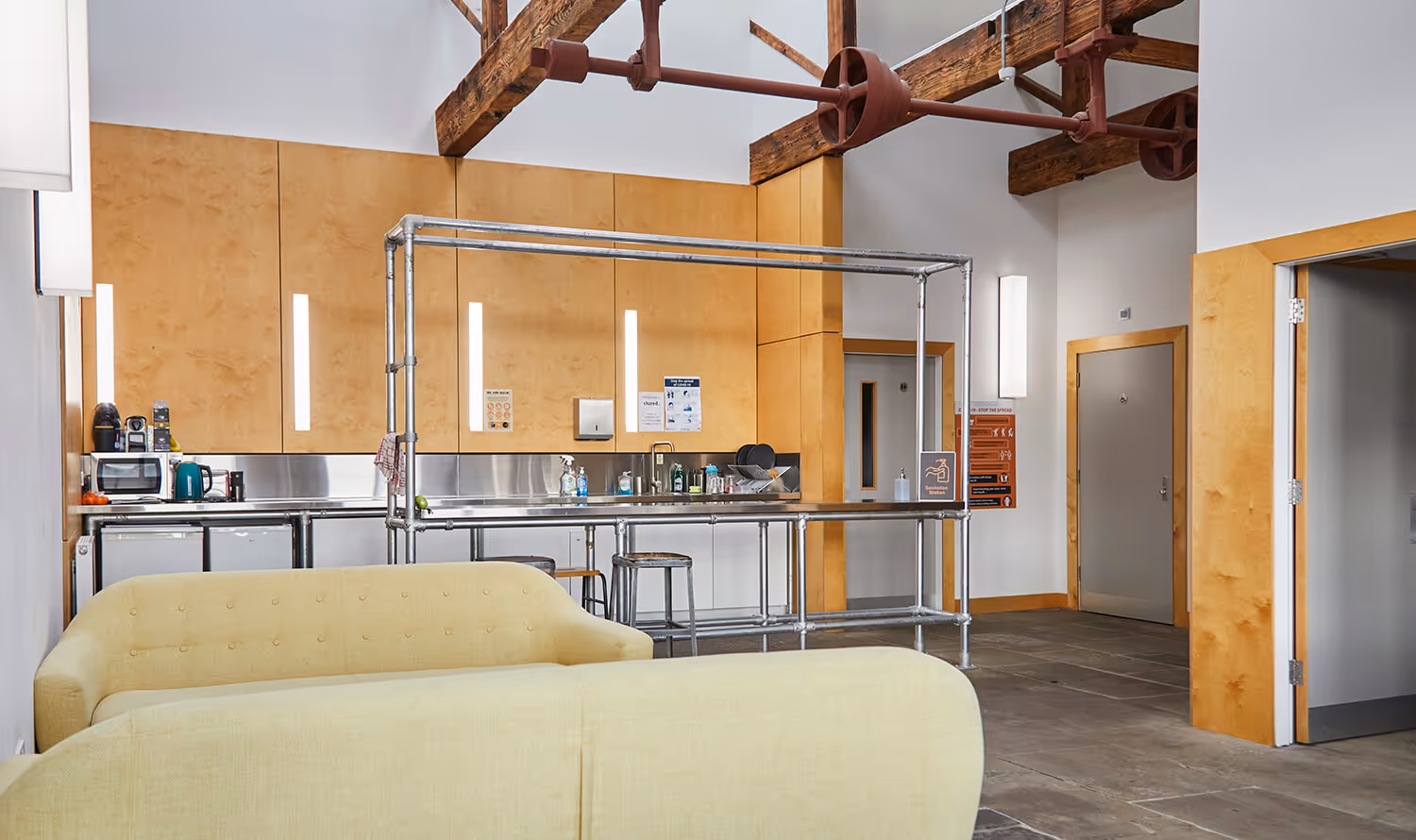 A kitchen and relaxing area at Castleton Mill in Leeds, flexible office spaces available to rent.
