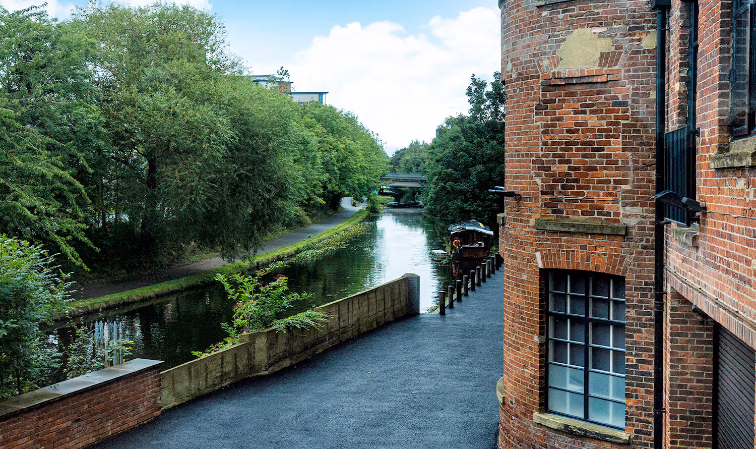 View of the Leeds Liverpool canal from Castleton Mill rental offices in West Yorkshire