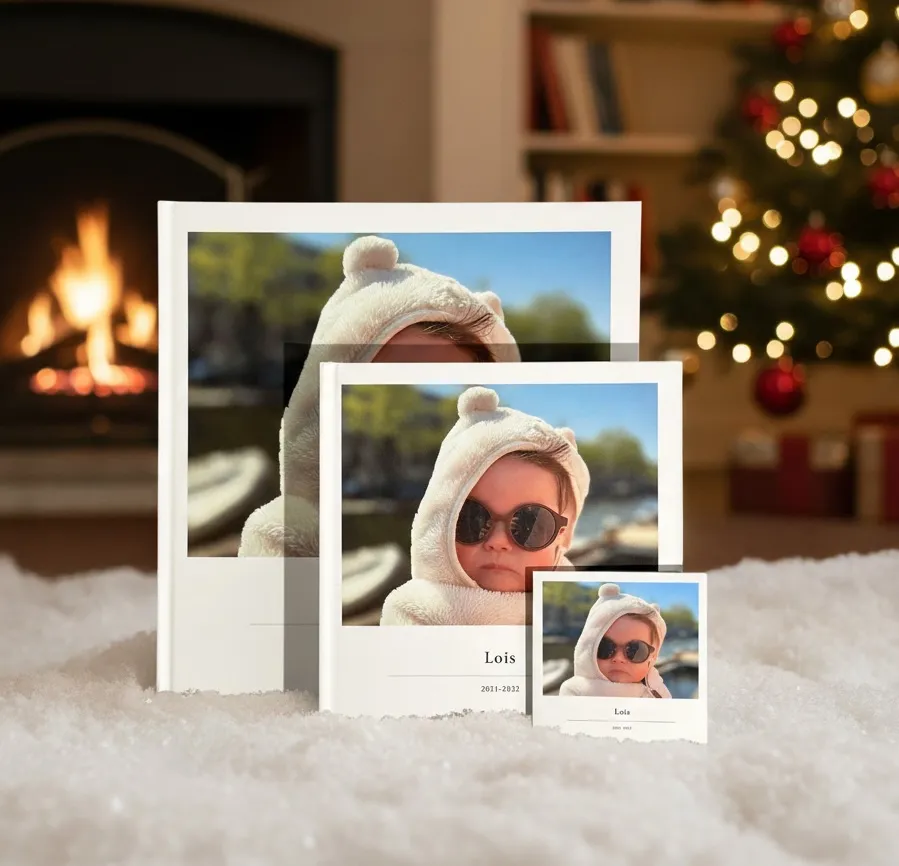 Three klikkie photo books stacked showing the XL, Large, and Pocket sizes with travel and family themes