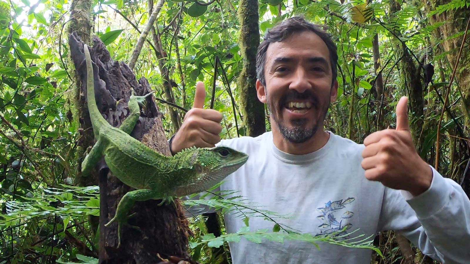 Rainforest Partnership scientist documenting amphibians during a biodiversity expedition in Peru.