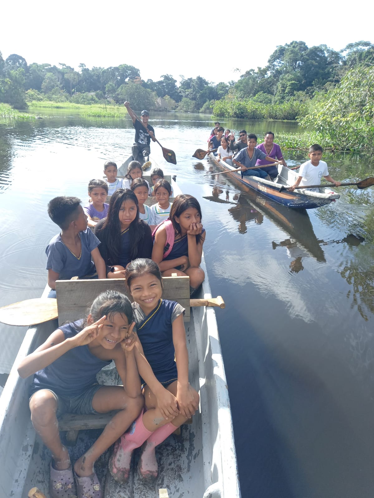 Children in a canoe on the Rio Napo River of Ecuador
