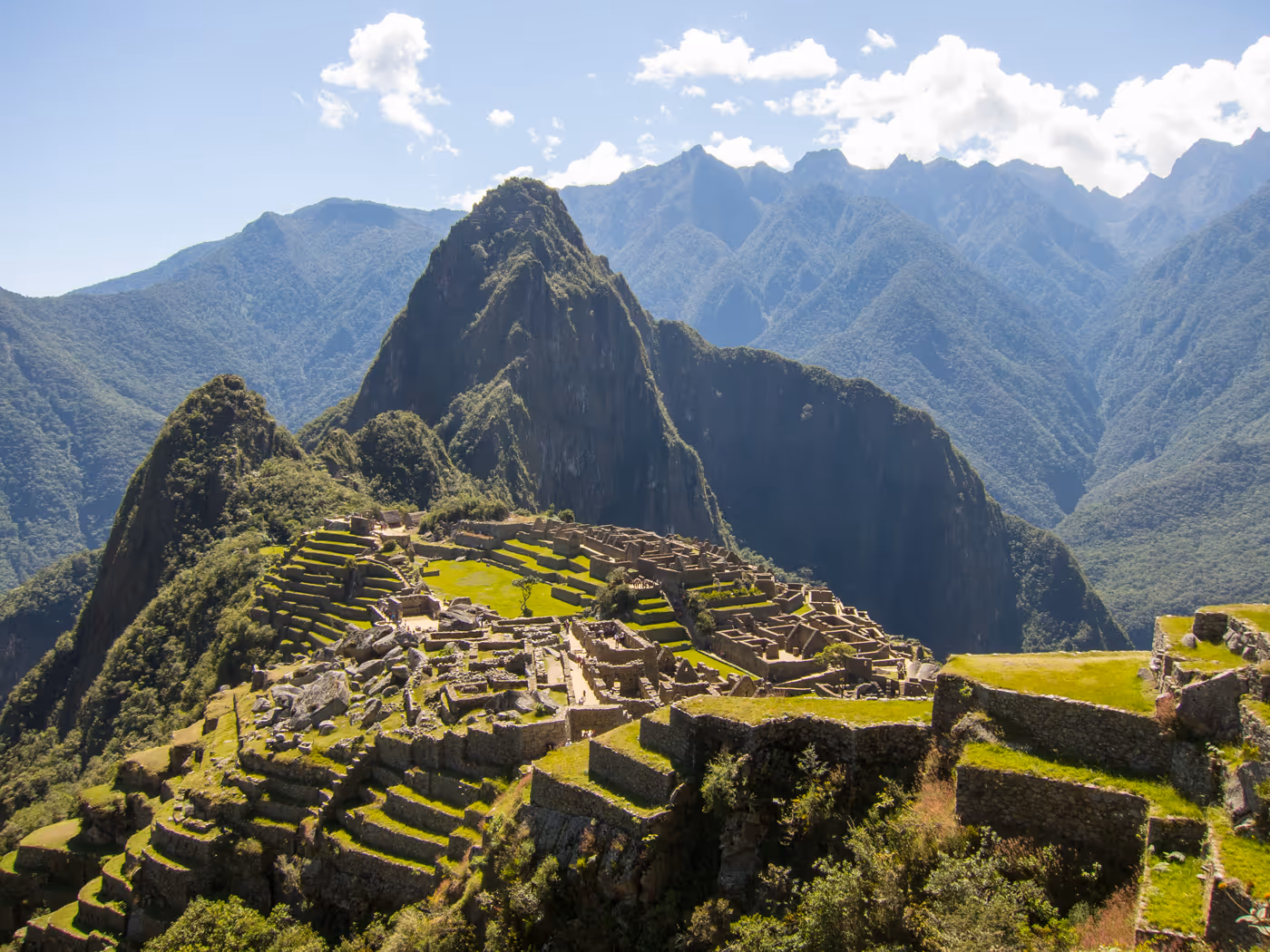 A lovely shot looking across Machu Picchu to Huayna Picchu on a Sunny Day - Hero Image