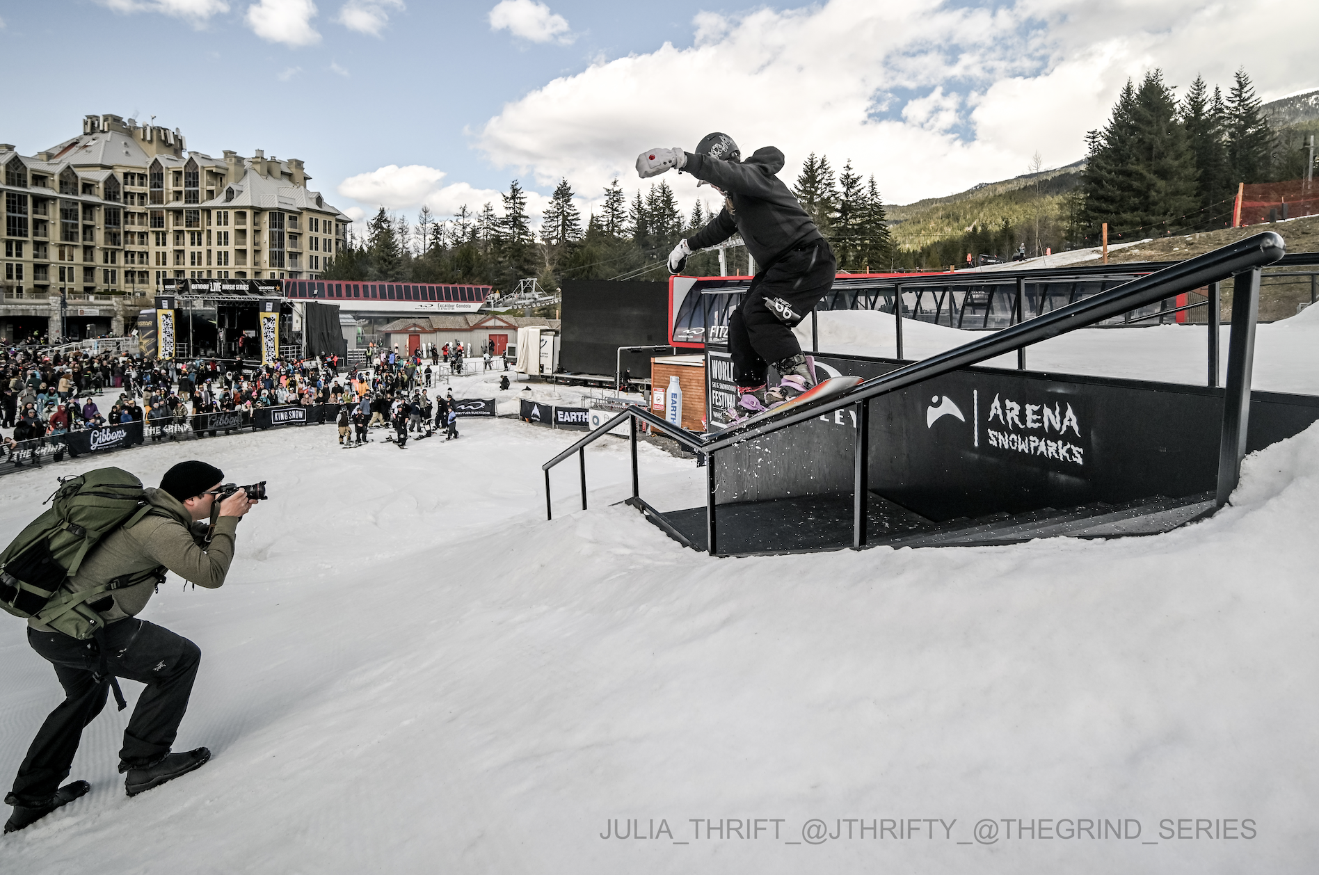 Image of portable battery power used on hillside with snowboarder riding rail