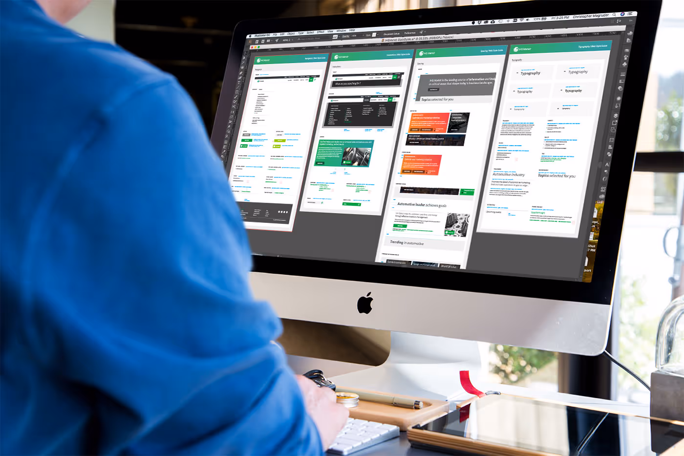 A designer building a website on the computer. 