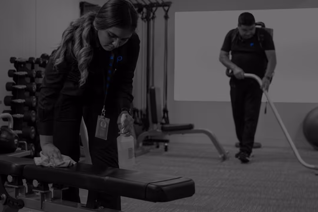 A group of Pioneer cleaners working in a fitness center. 