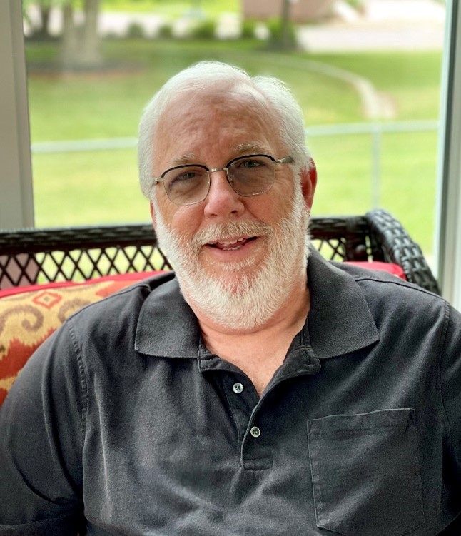 Headshot of Daniel Henderson, author and educator