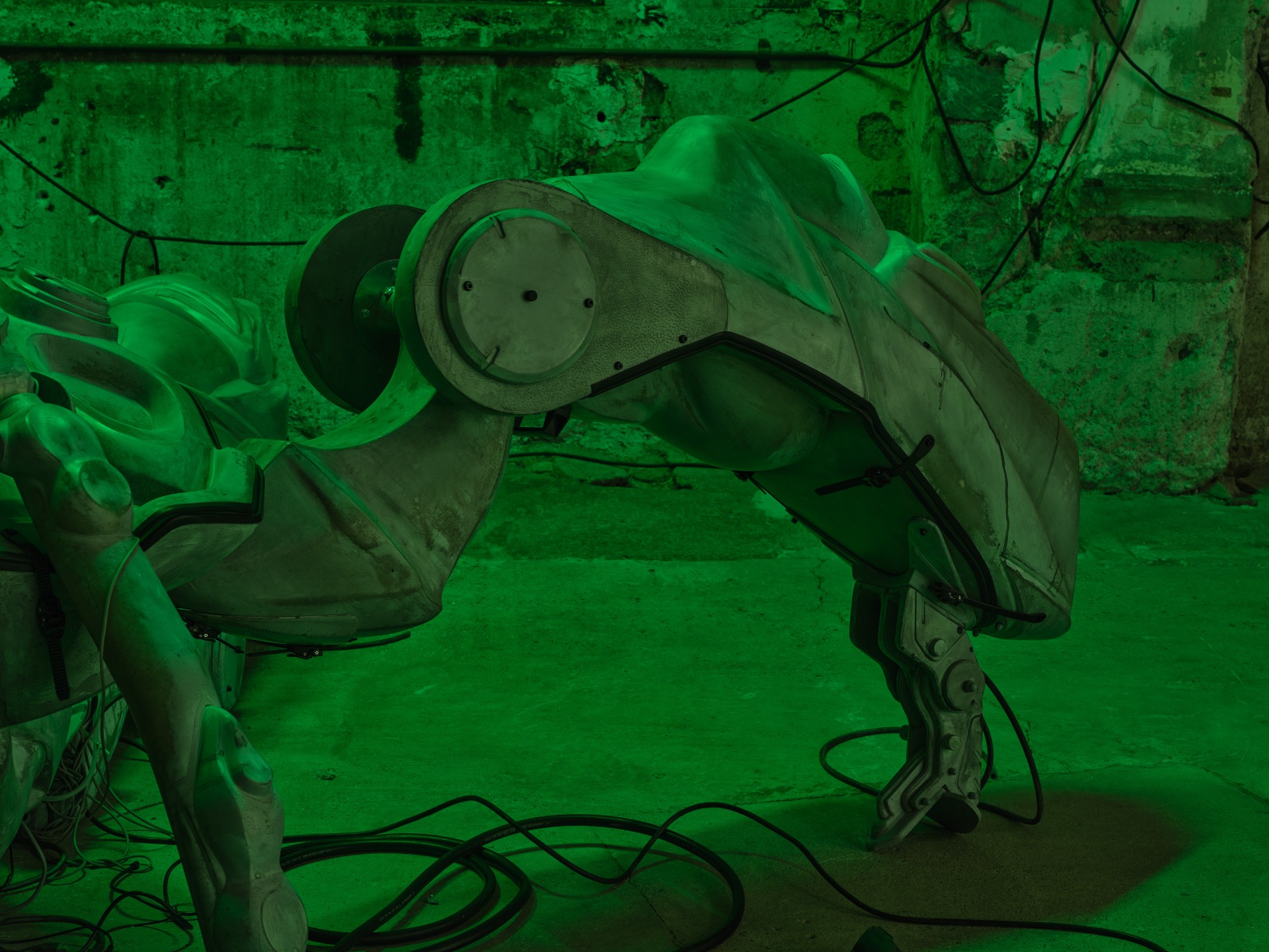 Detail of Mecha (protective suit) by Davide Allieri, mechanical joint and thin fibreglass wall revealing hollow interior, 2026