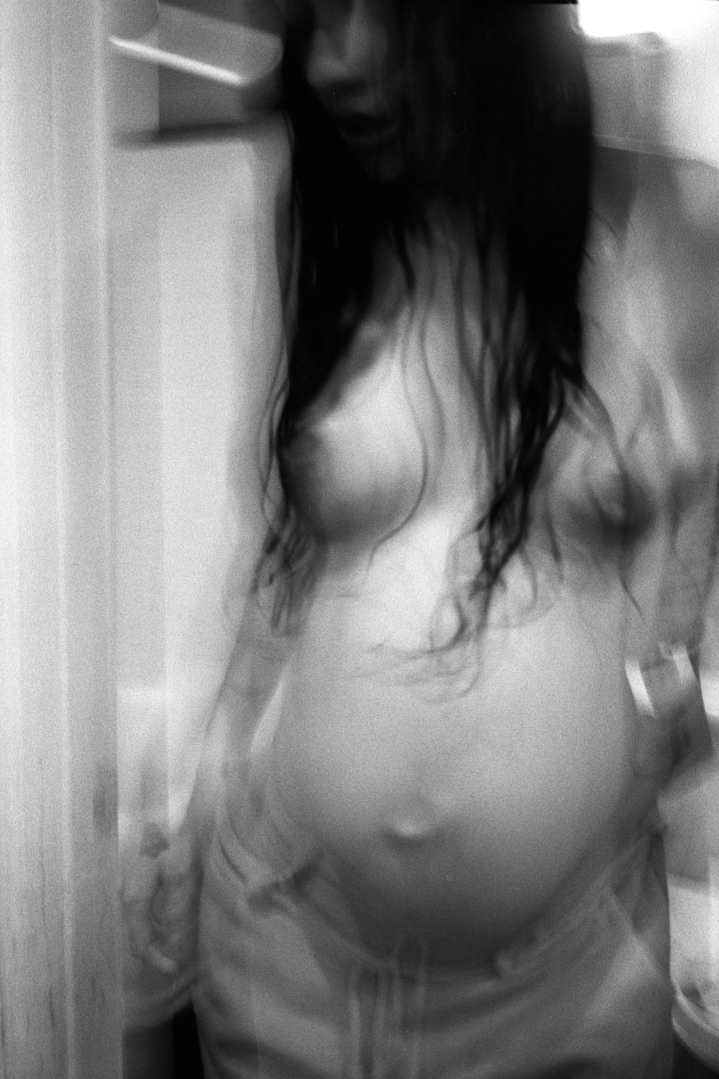 New Genesis by Abdulhamid Kircher — bathroom counter with crucifix, breast pump basket and feeding bottles photographed in a Los Angeles apartment.