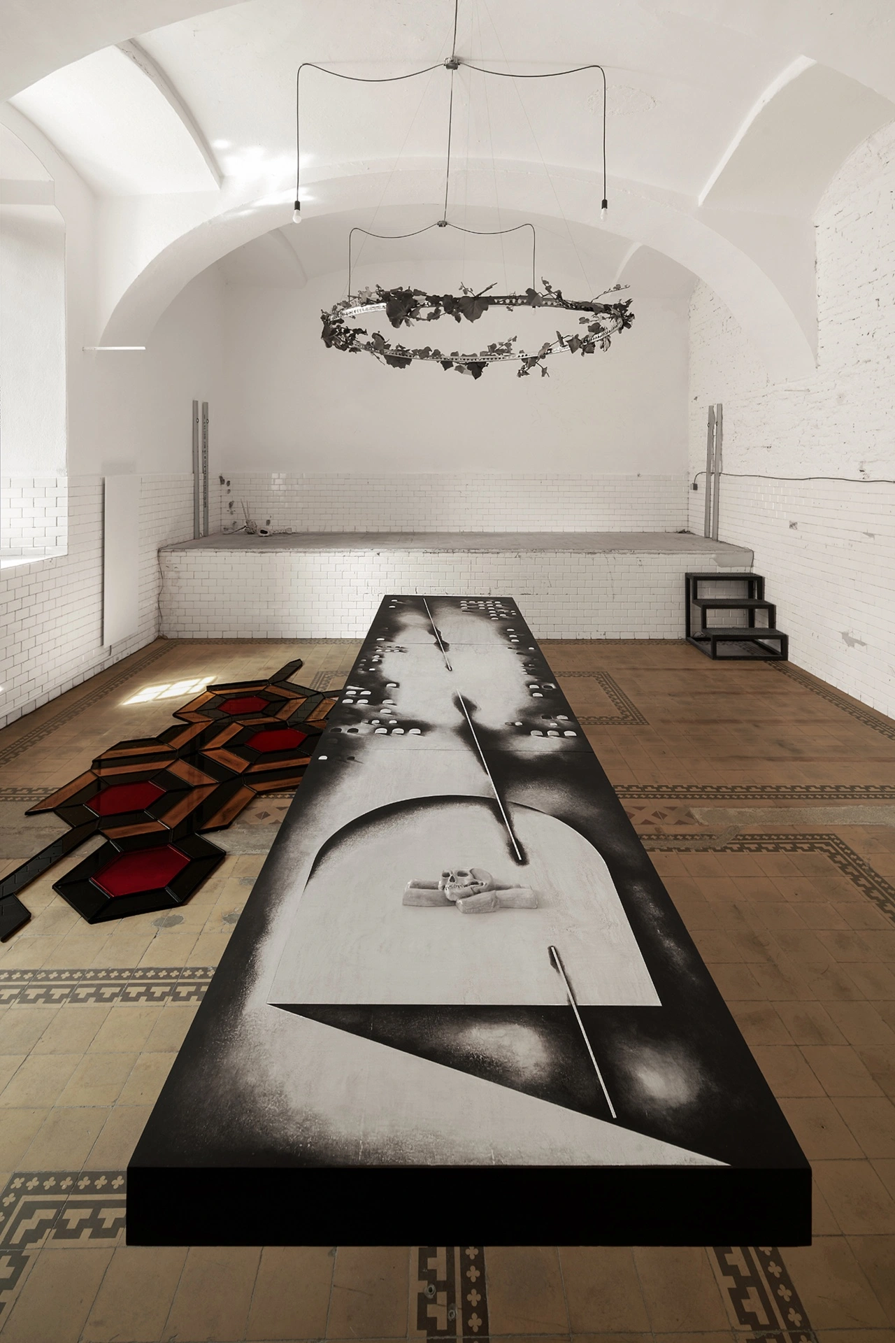 Sofiia Yesakova, dissection table installation with painted anatomical surface, scalpels, and skull, FAVU Gallery, 2026
