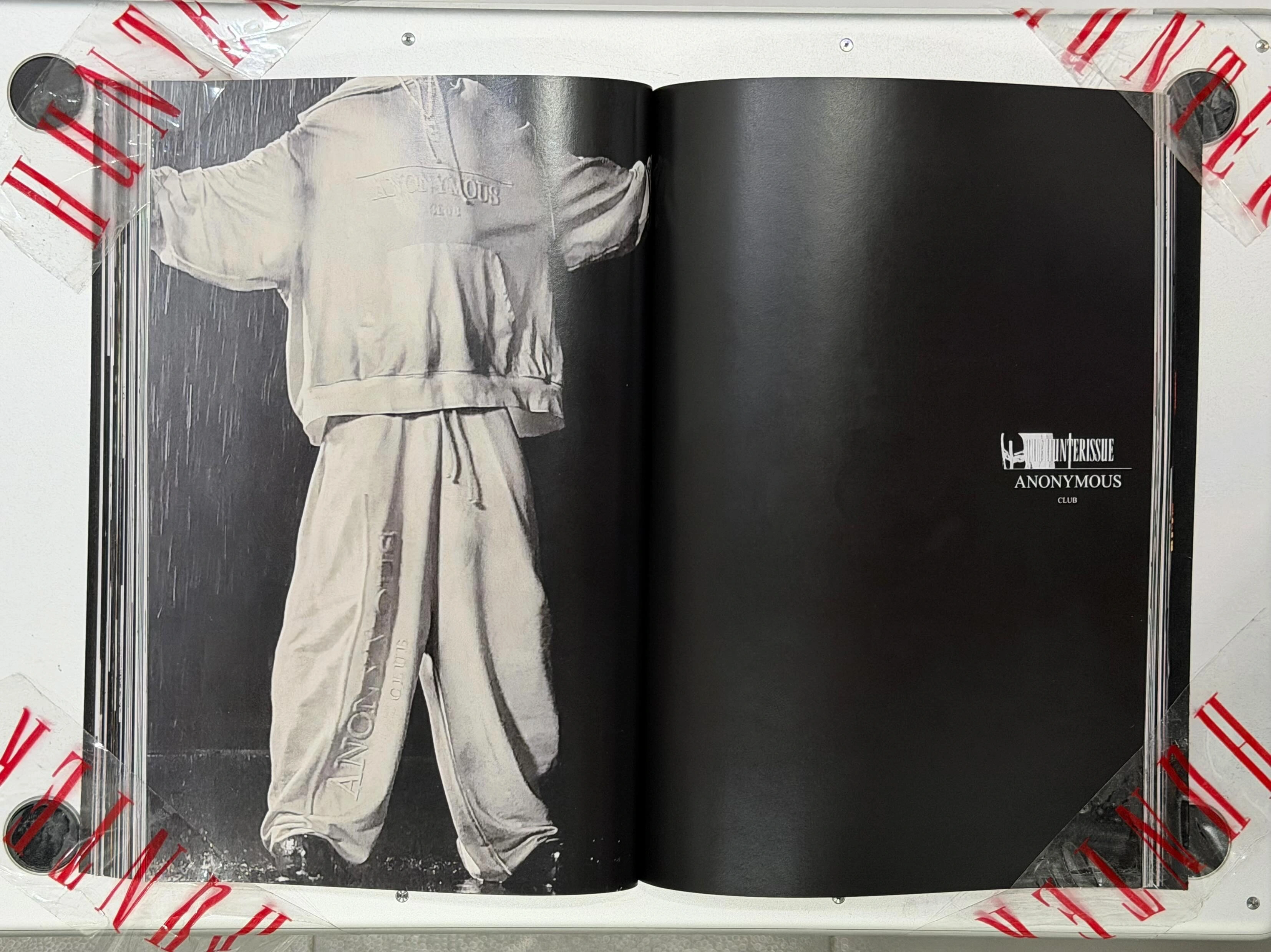 Spread from TheHunterIssue Vol.1 by Leo Shmunk, white silhouettes of kneeling and standing figures captioned SELF-PORTRAIT FOR VETEMENTS and SELF-PORTRAIT FOR BALENCIAGA, brand names set into the negative space, 2026
