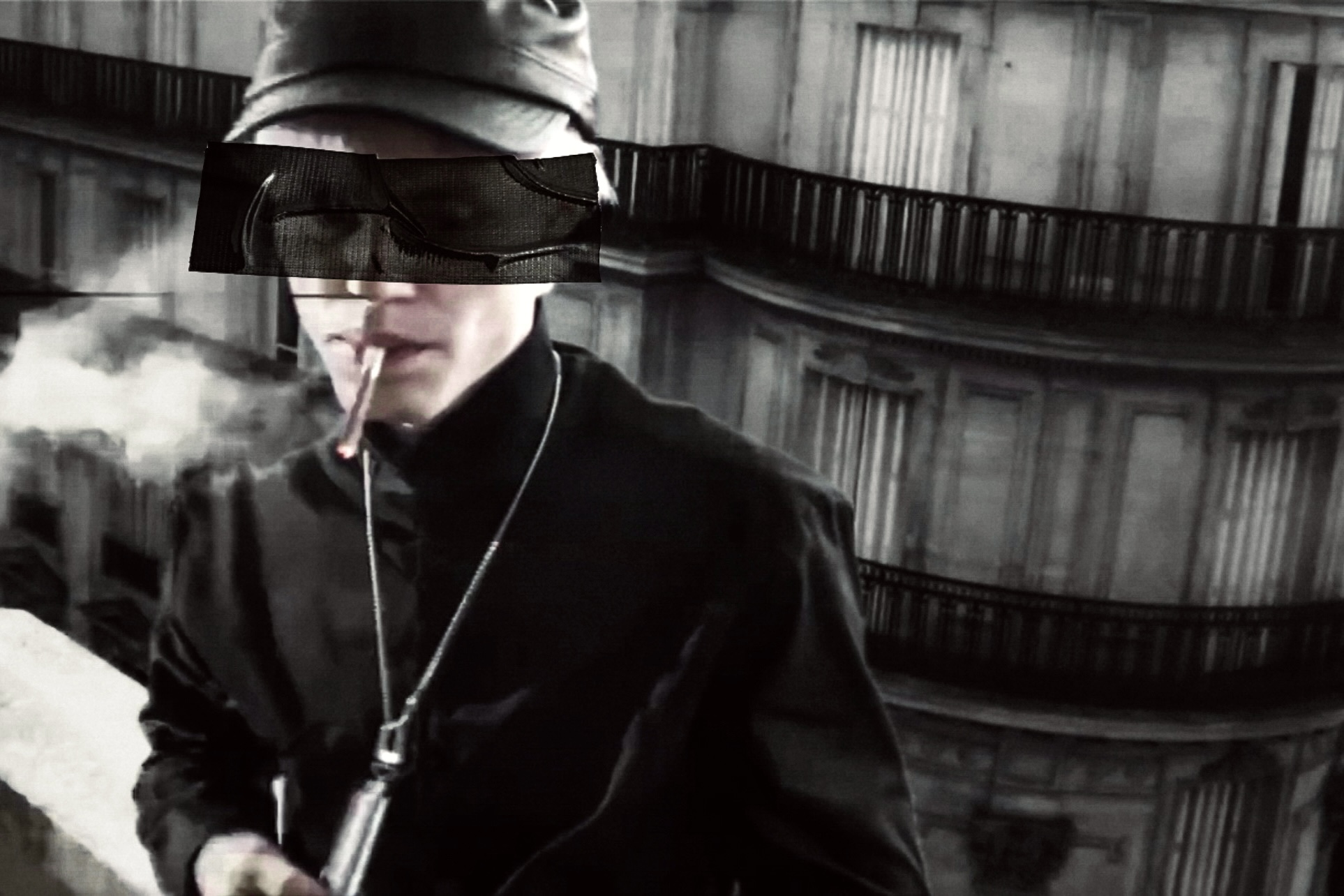 Spread from TheHunterIssue Vol.1 by Leo Shmunk, low-res still of a figure in black uniform and cap smoking on a balcony above a Haussmann facade, eyes redacted by a black censor bar, 2026. Photo: Leo Shmunk.