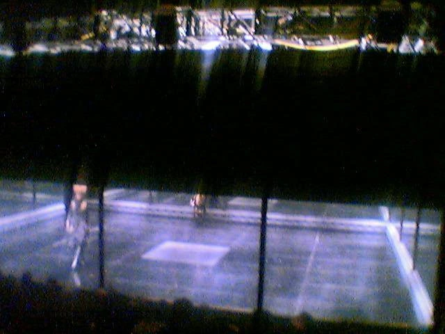 The lit stage seen from the far seats of Earls Court during the opening of Alexander McQueen's Black.