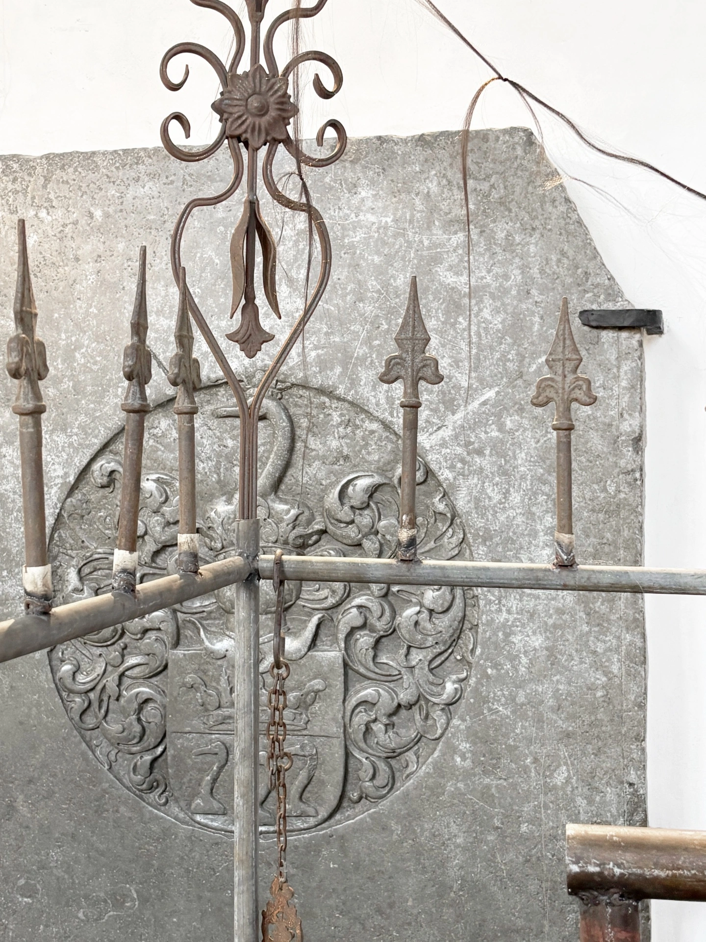Angelika Puff, Bird Cage, 2025 — close detail of braided hair coiled and knotted around an iron bar, organic and metal textures in contact.