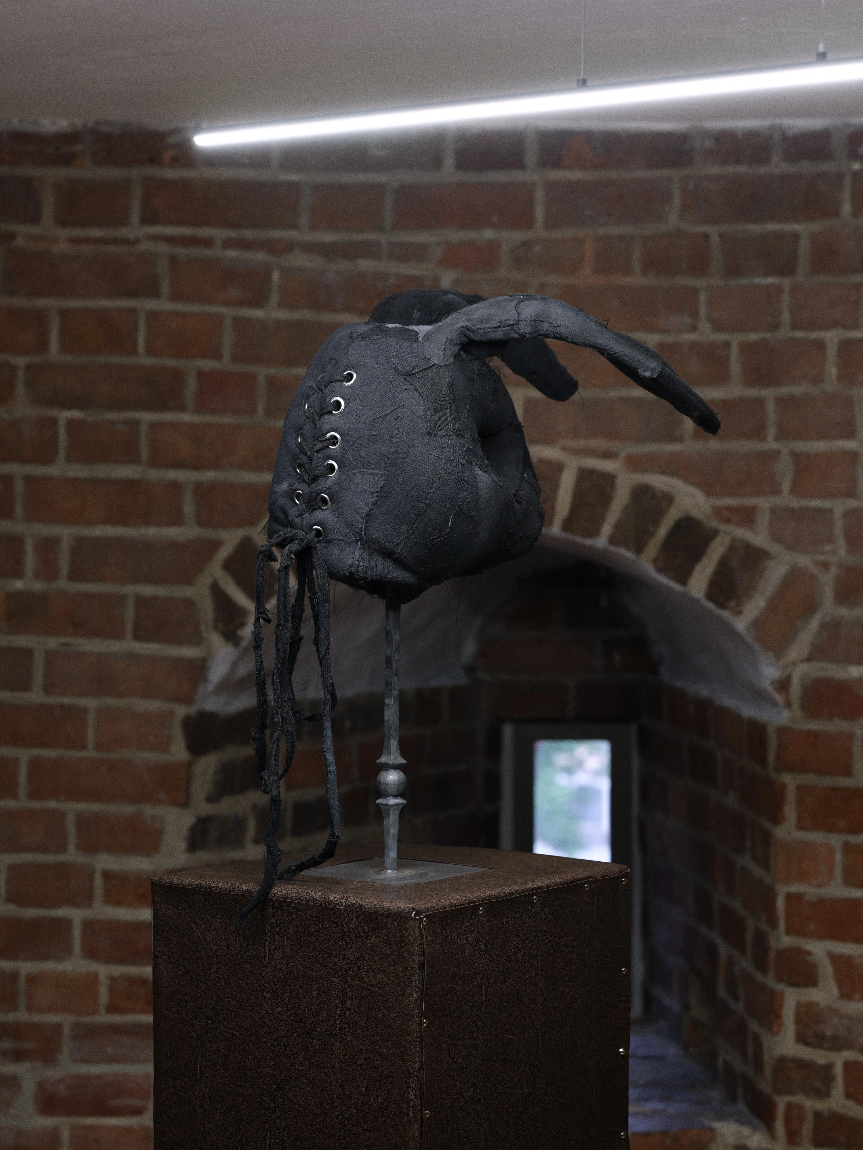 Jan Baszak, Rabbit Mask seen from behind, laced through eyelets with ribbons where it would close at the back of a head