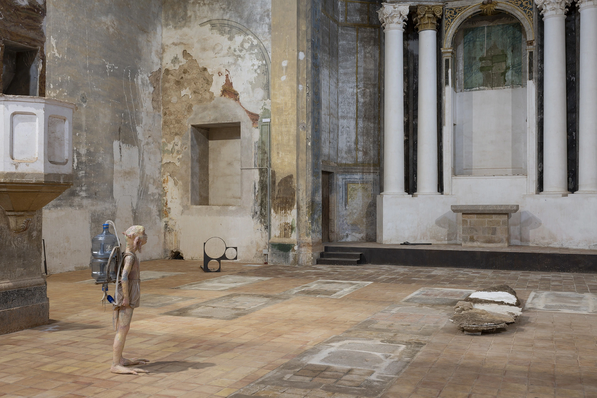 Installation view of KIN TOO across the nave floor of the Church of Sant Feliu, Lladó.
