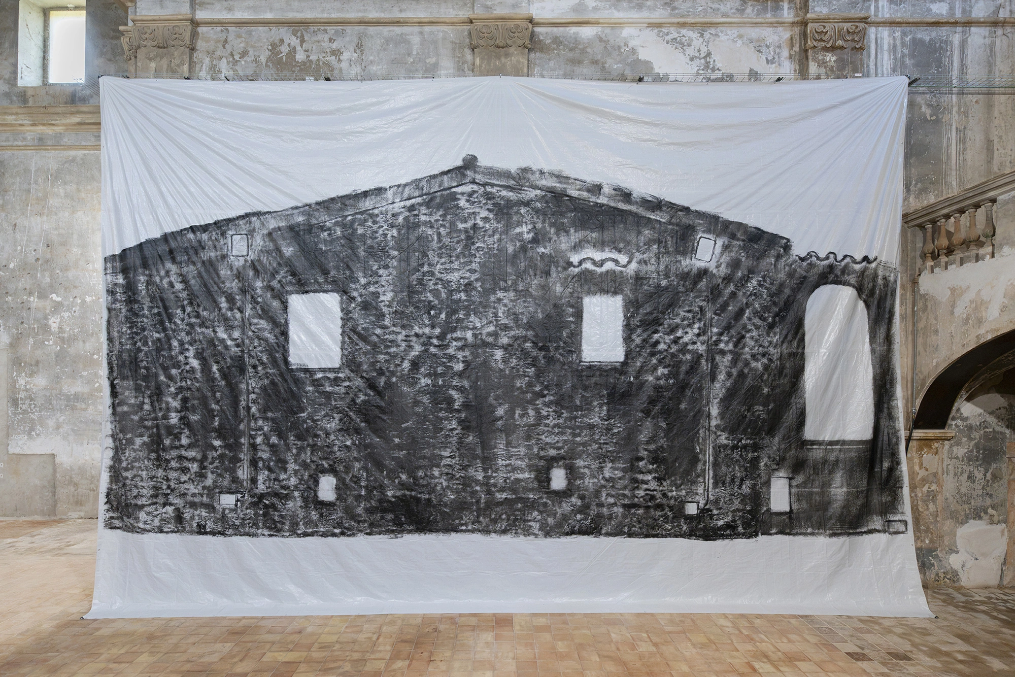 Frontal view of Andrew Birk's Floating House, the windows and doorway of the imprinted farmhouse left as white voids.