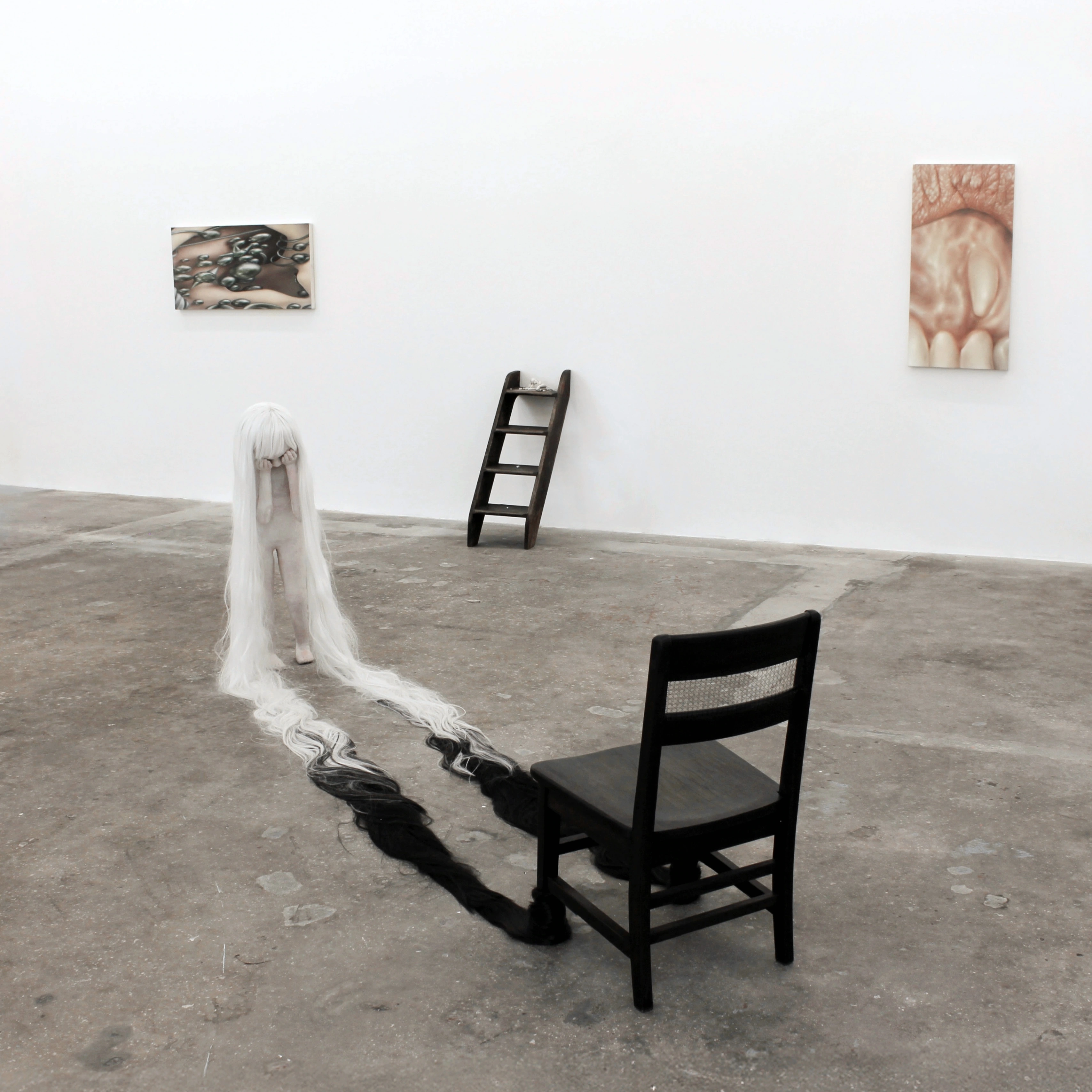 Installation view of Common Skin Fantasy at KDR, Miami, 2026, with Alicia Bilbao's Orphaned Objecthood and its chair