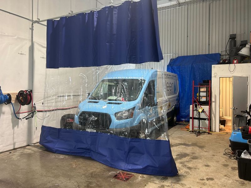 Detailing bay at 138 Wescar Lane with service van inside