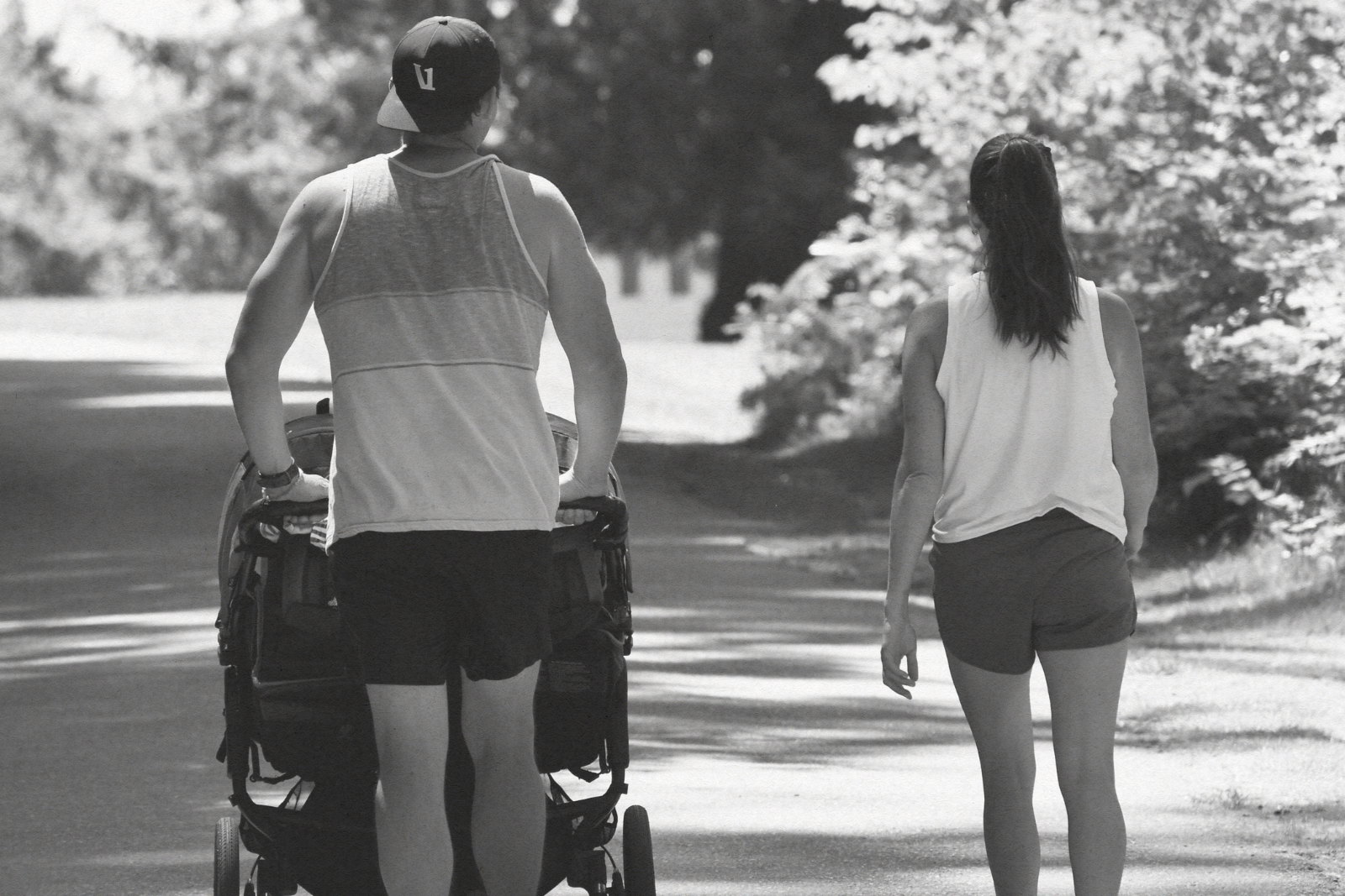mom and dad walking with stroller