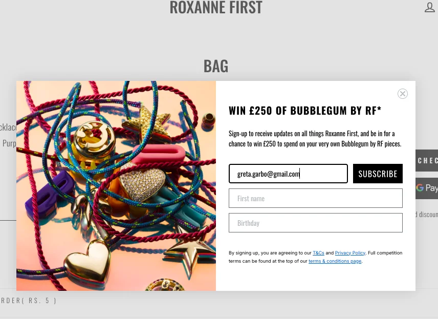Roxanne First features a giveaway pop-up around the abandoned jewelry product at checkout