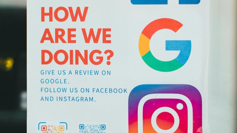 Sign encouraging guests to leave reviews on Google, Facebook, and Instagram, highlighting the importance of guest feedback for hotel visibility.