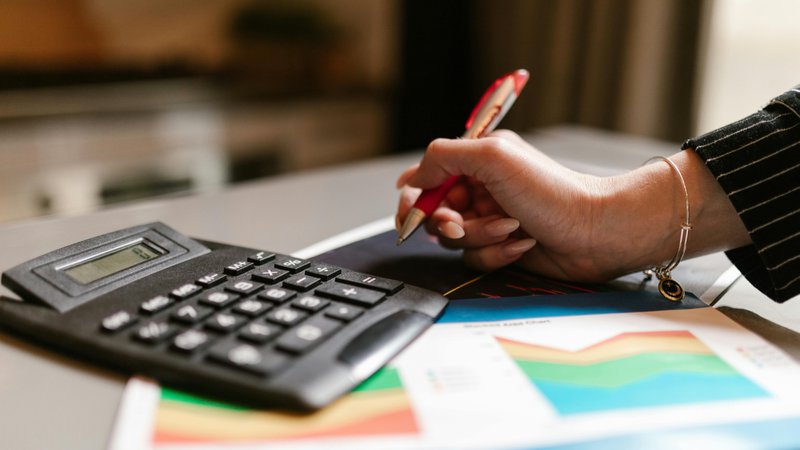 Hotel revenue manager reviewing pricing data and reports