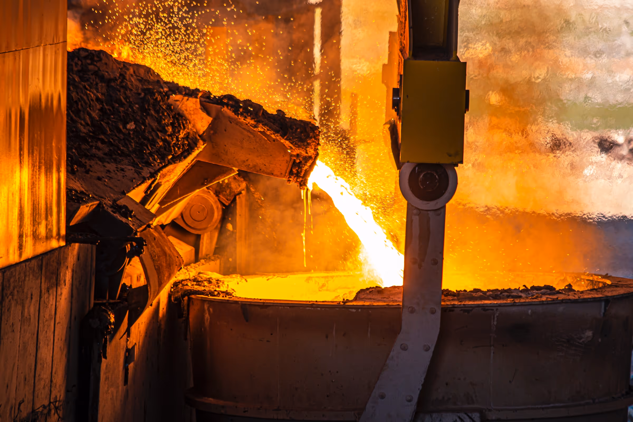 a large metal pot with a bright yellow flame coming out of it