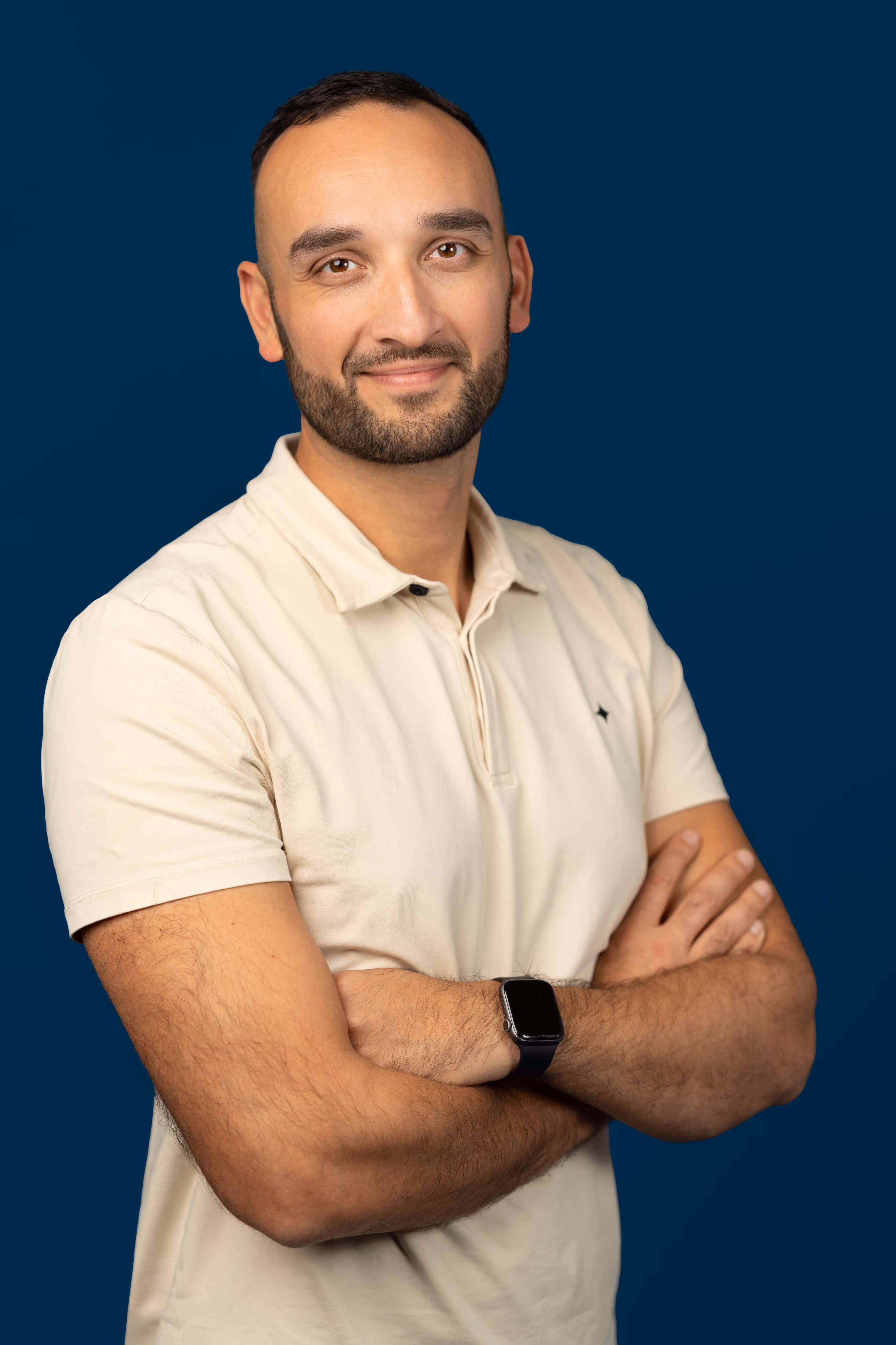 a man in a white shirt is posing for a picture