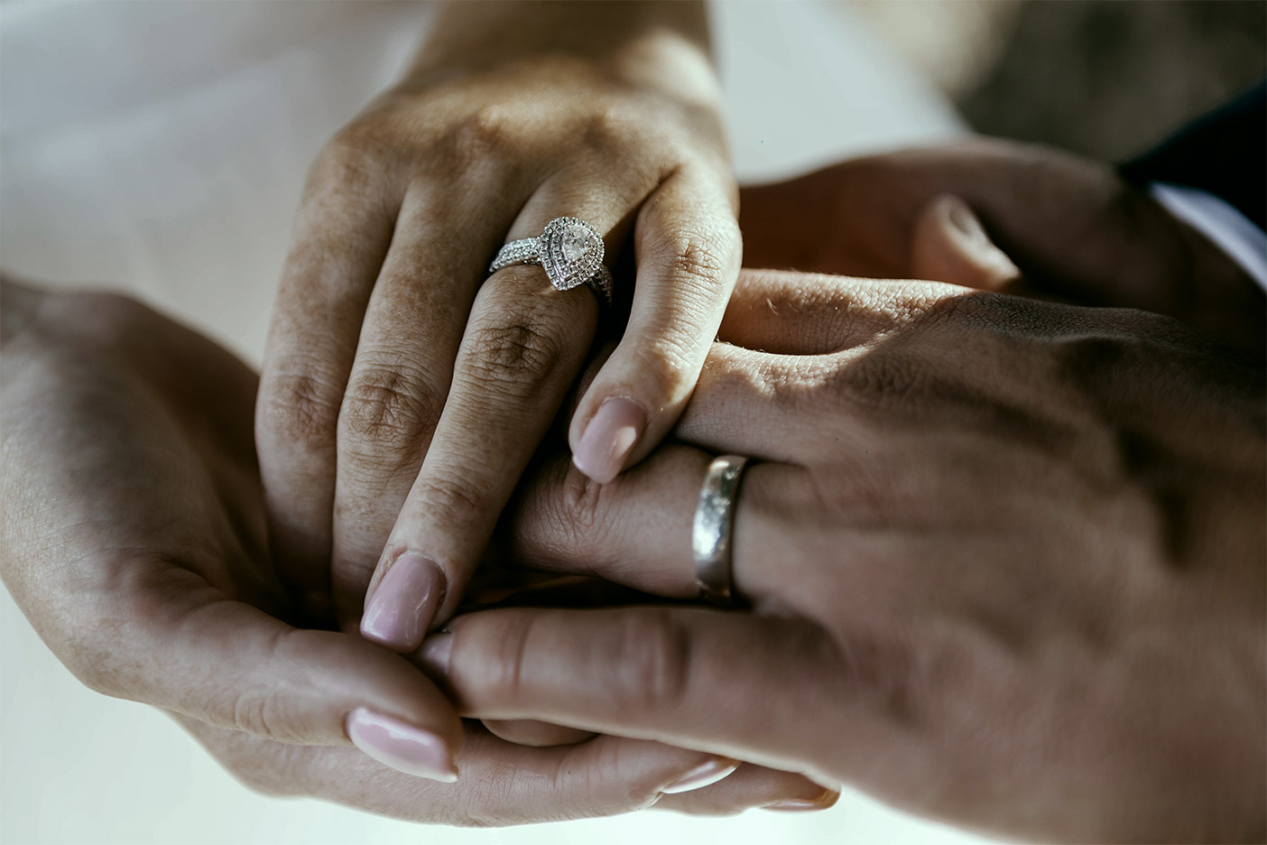 The bride and groom holding hands.