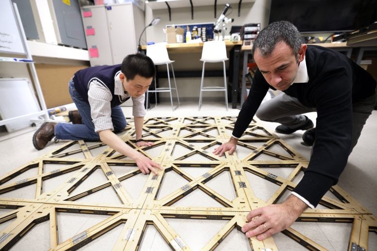 Yi Zhu and Evgueni Filipov Working in Lab