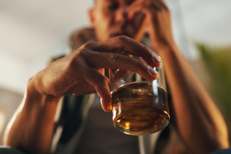 Stressed Alcoholic Man Drinking Glass of Whiskey