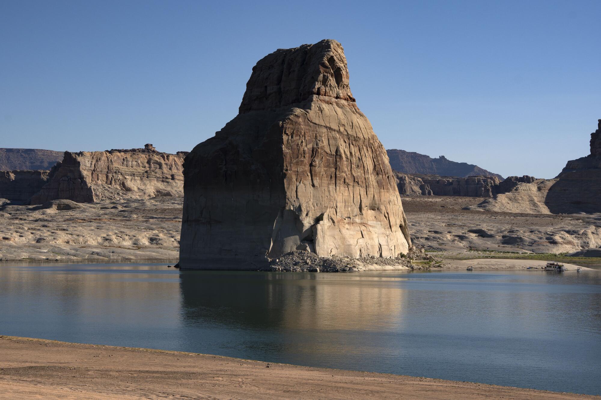 Morning sunlight hits Lone Rock on Lake Powell in Glen Canyon National Recreation Area.