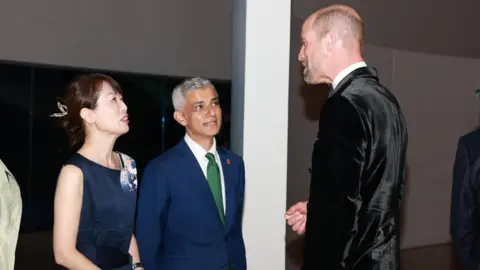 Daily Mirror/PA The Prince of Wales speaks with London Mayor Sir Sadiq Khan. They are both wearing suits. 