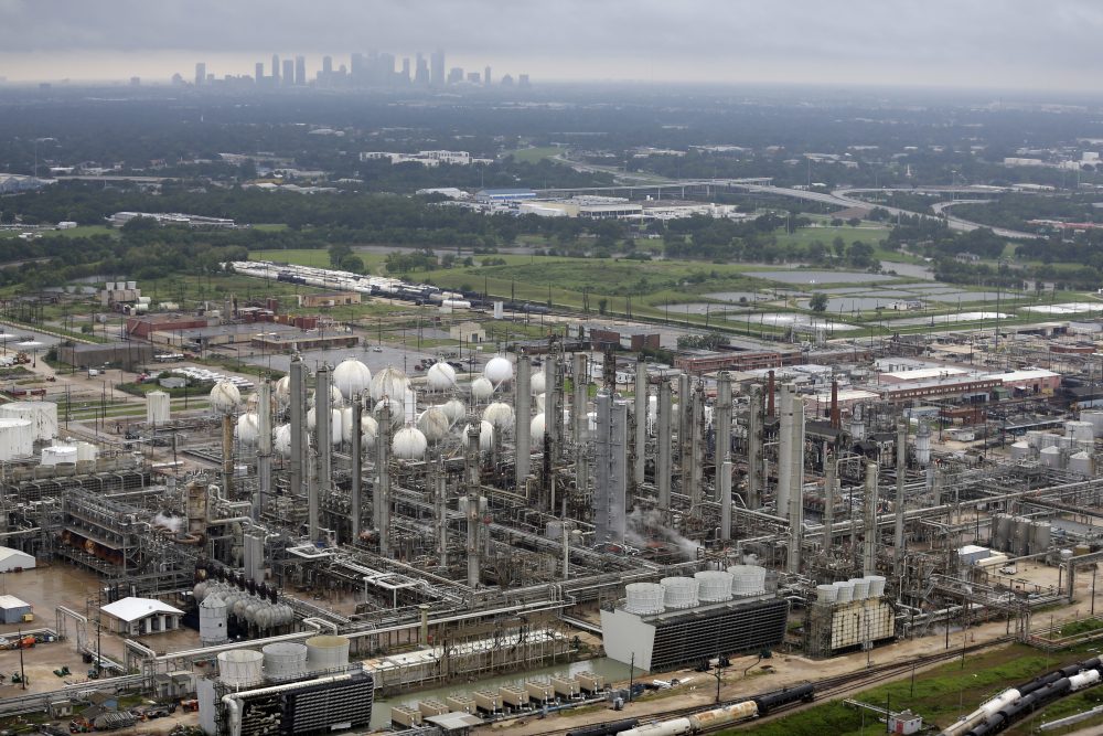 ADDS NAME OF CHEMICAL PLANT - This aerial photo shows the TPC petrochemical plant near downtown Houston, background, on Tuesday, Aug. 29, 2017. (AP Photo/David J. Phillip)