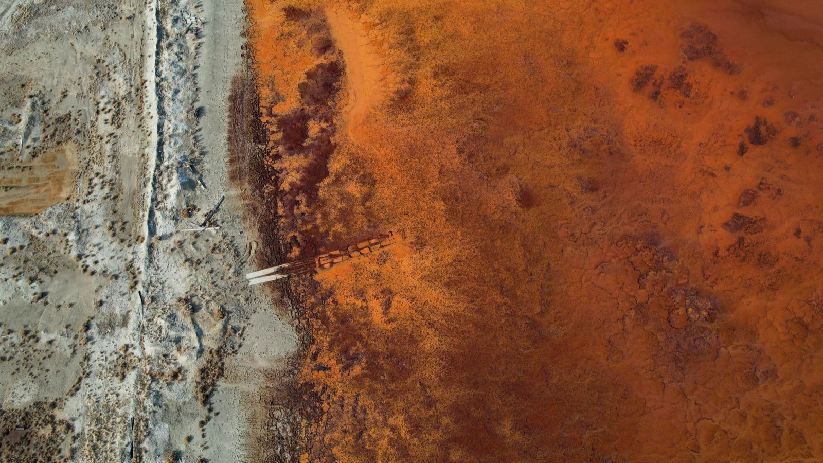 Orange-hued wastewater at an industrial site