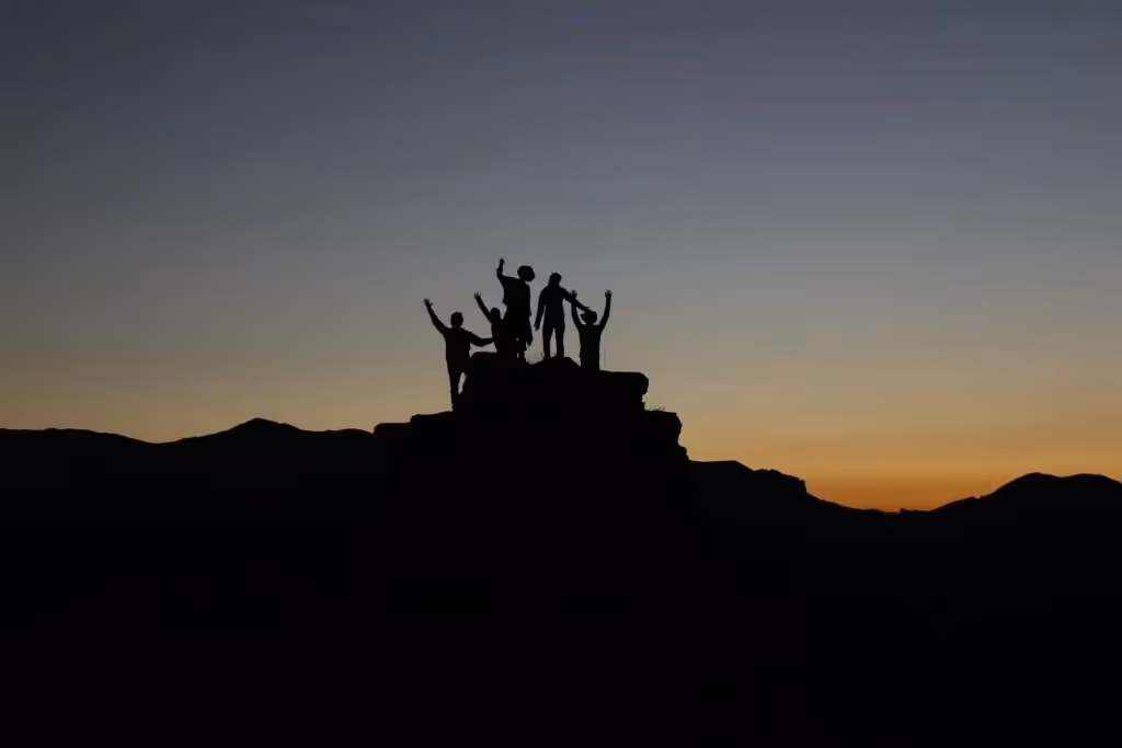 A Team on Top of a Mountain