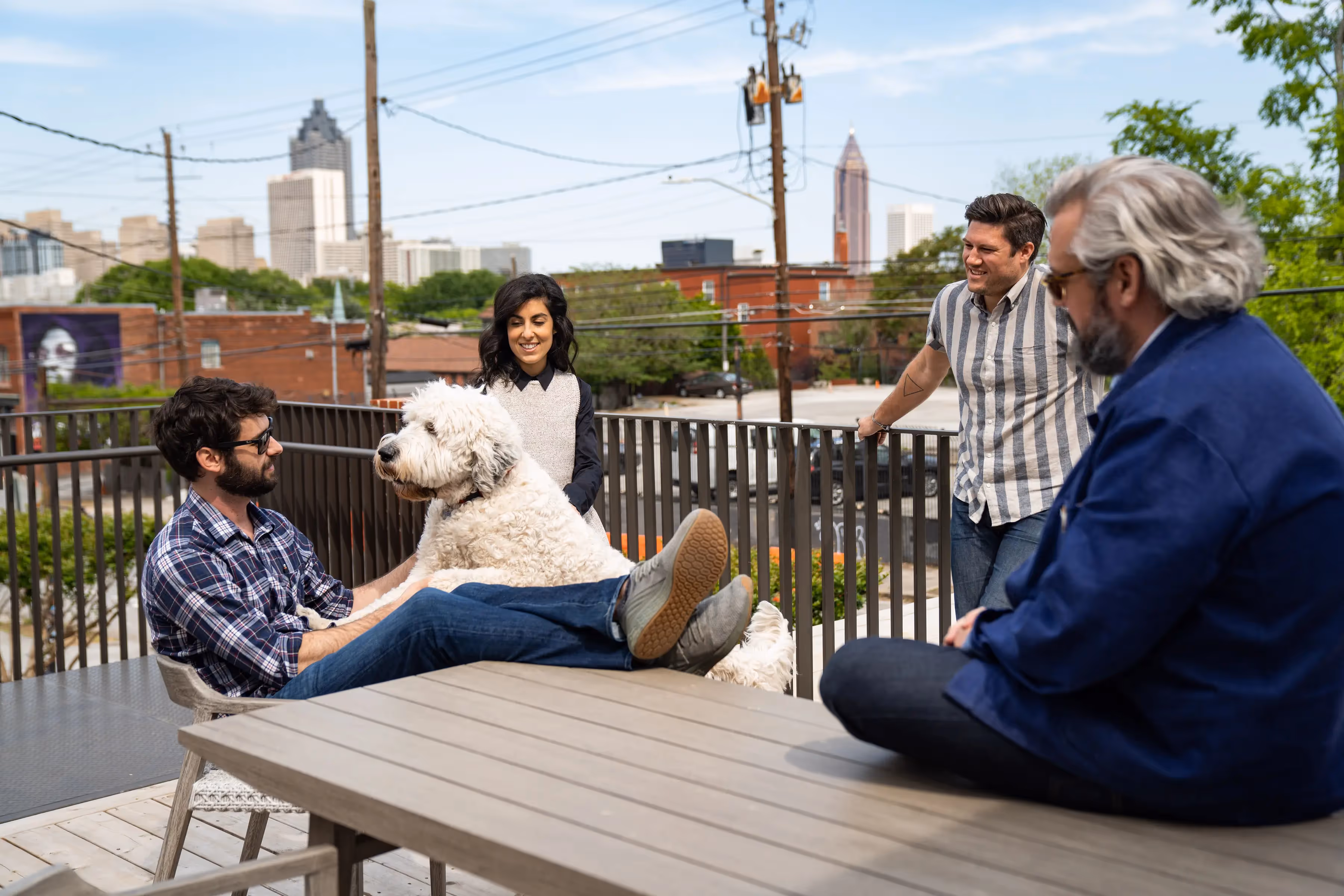 Team Gathered Around One of the LOCAL Dogs 