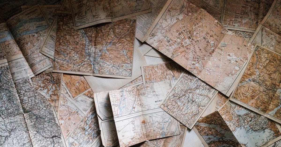 A scattered stack of vintage maps.