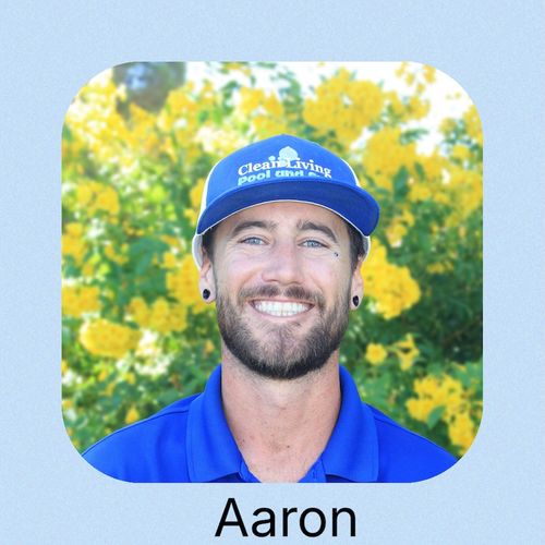 A person wearing a hat with the logo "Clean Living"