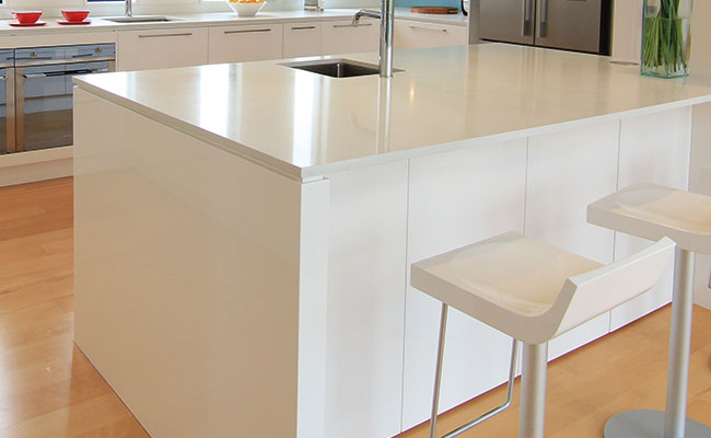 White engineered stone with matching white cabinet unit 