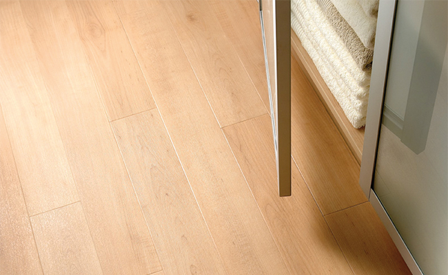 Natural coloured vinyl planks with a high-quality realistic wood finish.