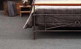 dark grey coloured polypropylene carpet in bedroom 